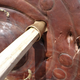 A spear penetrating a shield.